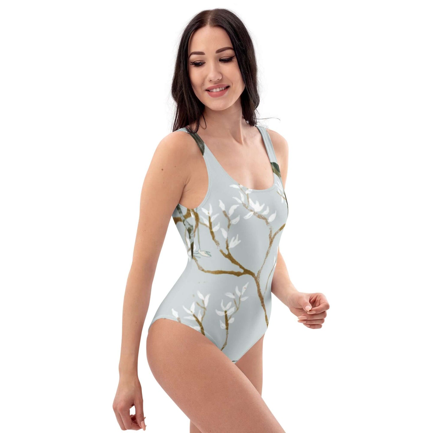 Costume da bagno intero elegante con design floreale, ideale per look da spiaggia e moda mare 2025.